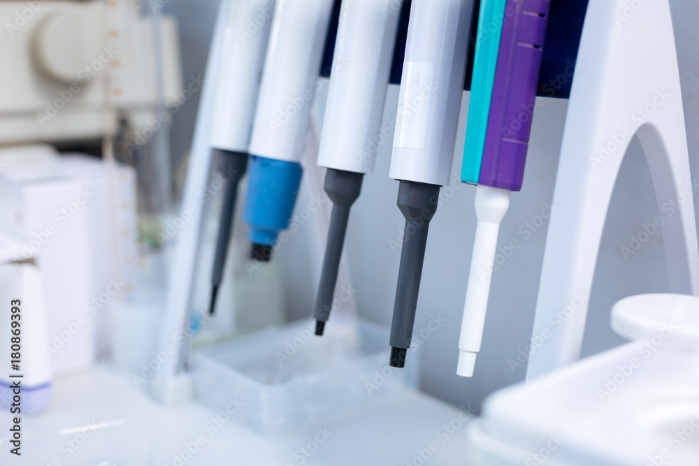  Be sure. Sophisticated modern equipment hanging on special shelf which standing on the desk and waiting for being used 
