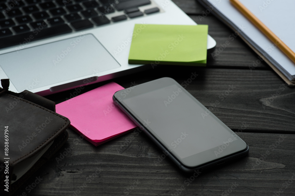 smartphone, sticky notes and laptop smartphone, sticky notes and laptop