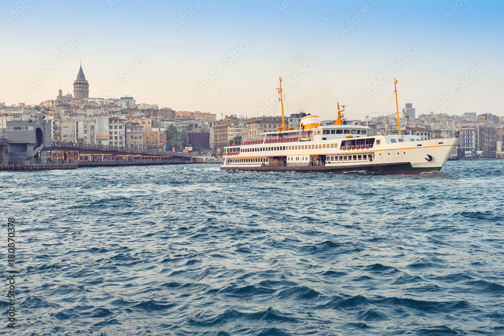 The ship carries passengers along the Bosporus Strait.
