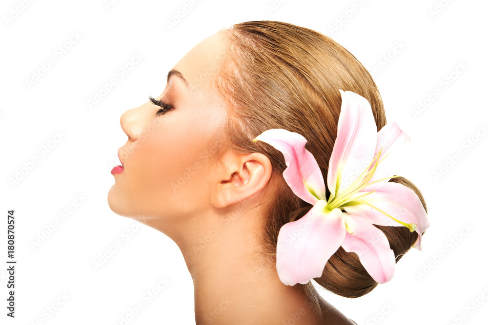 Beautiful spa woman with lily.