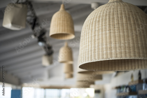 Straw chandeliers in a trendy bar on the beach, summer