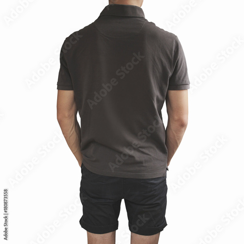 Dark grey t shirt and black shorts on a young man template on grey background.