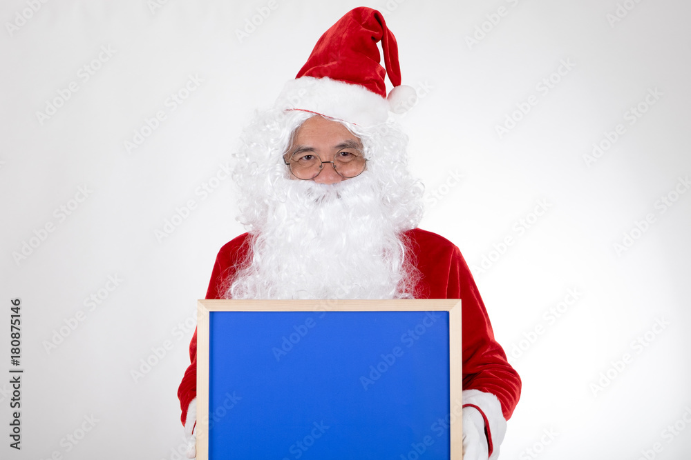 Santa claus holding blue billboard in hand on white background Santa claus holding blue billboard in hand on white background