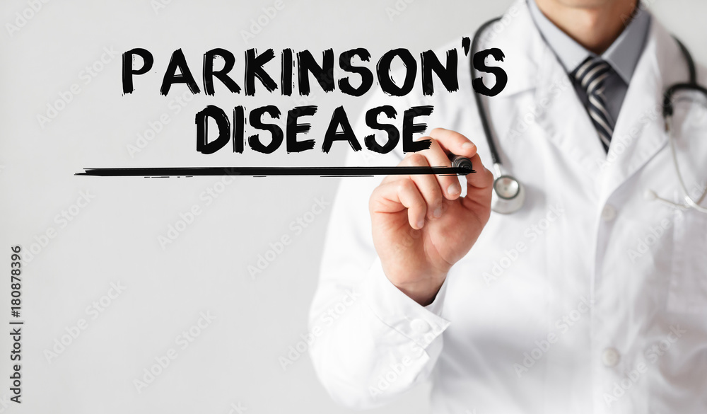 Doctor writing word Parkinson's Disease with marker, Medical concept Doctor writing word Parkinson's Disease with marker, Medical concept