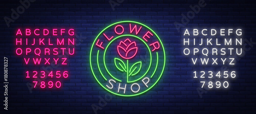 Flower shop logo, neon sign. Vector illustration on the theme of selling flowers. Neon banner, vivid advertising of flowers, night sign. Editing text neon sign. Neon alphabet