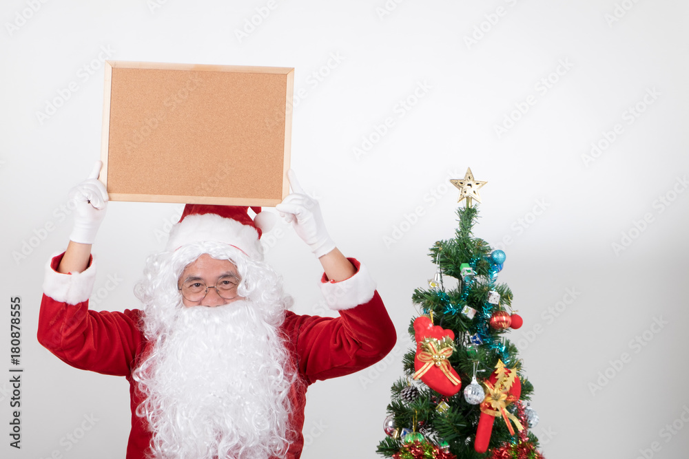 Santa claus holding brown billboard on white background Santa claus holding brown billboard on white background