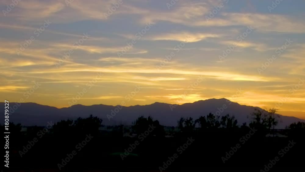 Sunset aerial shot ascending with mountains on the horizon in Palm Desert Sunset aerial shot ascending with mountains on the horizon in Palm Desert