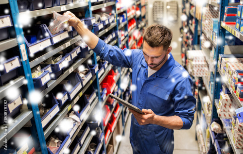 auto mechanic or smith with tablet pc at workshop