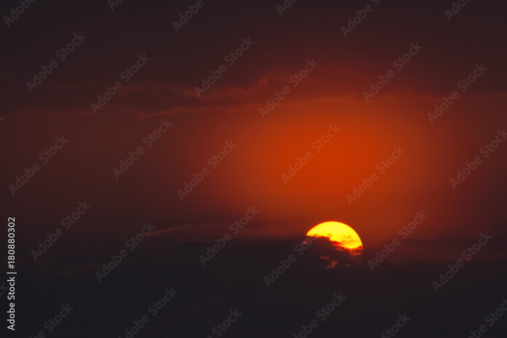 round yellow sun on a dark background