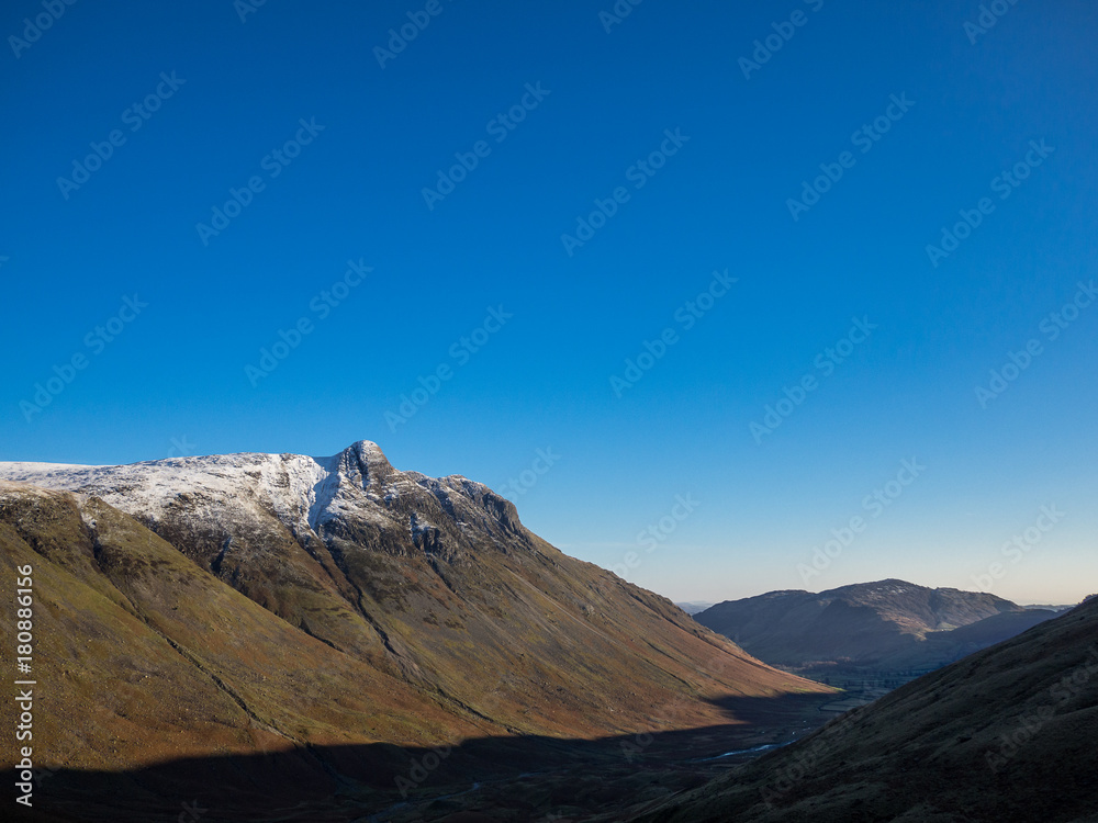 Shadows and Snow covered peaks in Langdale Valley Lake District Shadows and Snow covered peaks in Langdale Valley Lake District
