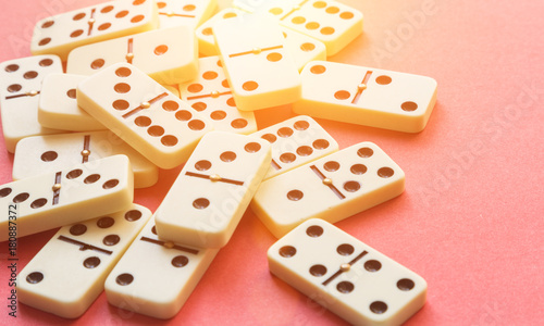 Domino on Pink background. Flat lay