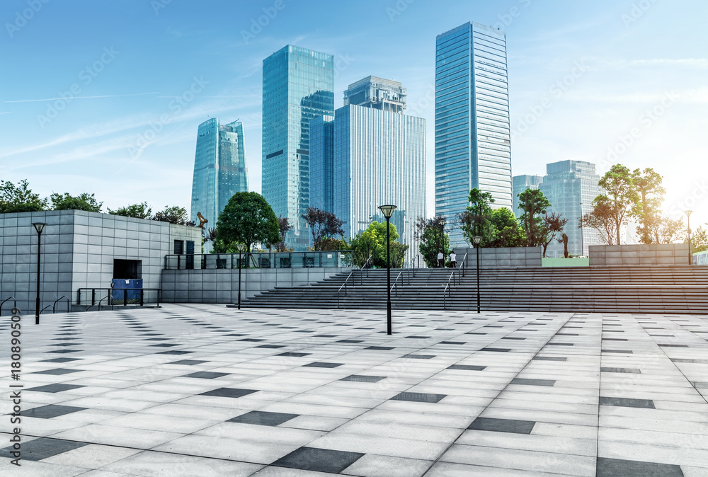 Panoramic skyline and buildings with empty concrete square floor