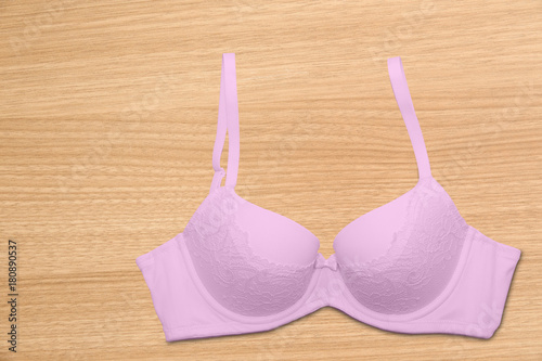 Isolated top view of woman's pink bra on white background