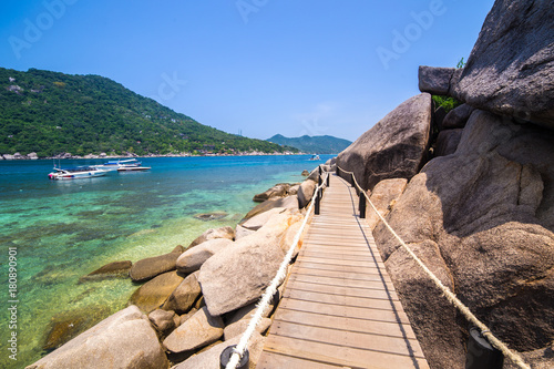 Wallpaper Mural A wooden footbridge at a rocky beach in thailand Torontodigital.ca