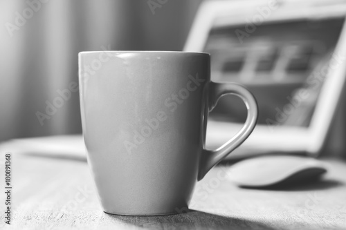 Grey mug on the desktop