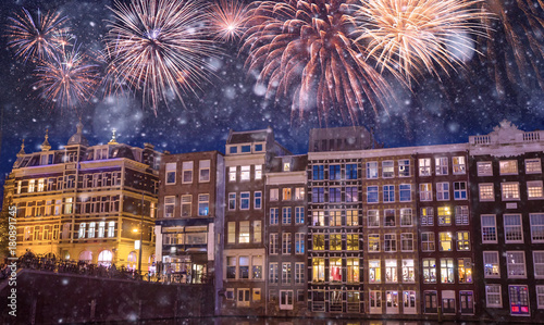 Photography Traditional old buildings and boats at night with fireworks on the black sky in