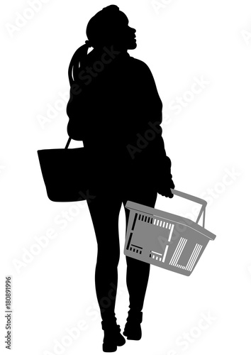 Silhouette of a woman walking with shopping basket