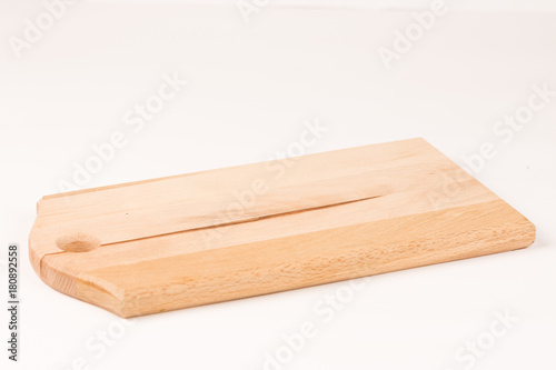 Wooden kitchen cutting board isolated above white background