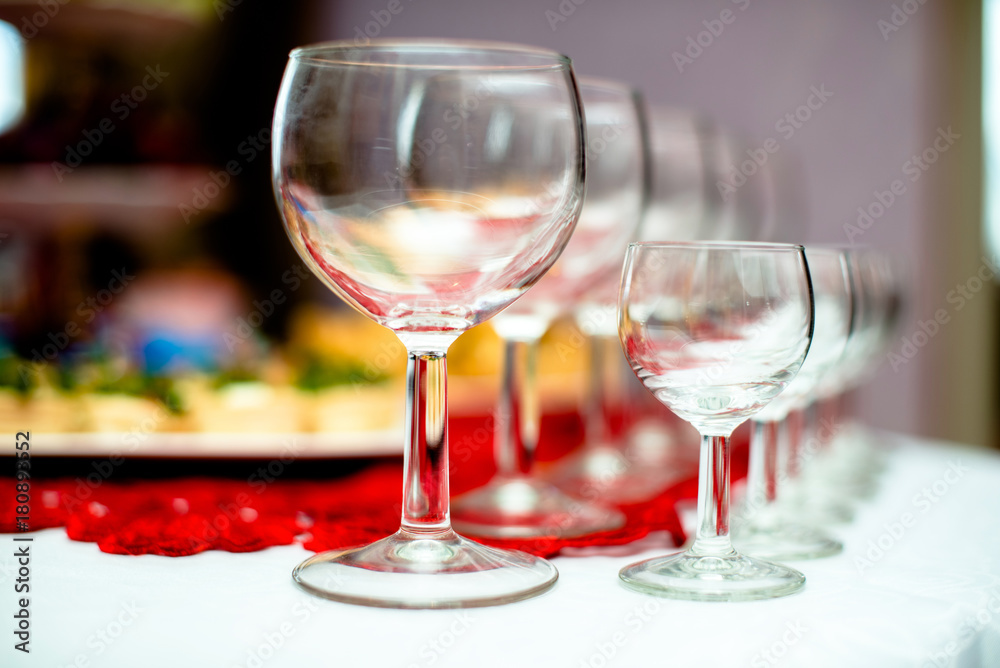Glasses for alcoholic drinks are on the table