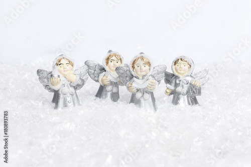 Angels choir singing for christmas in the snow