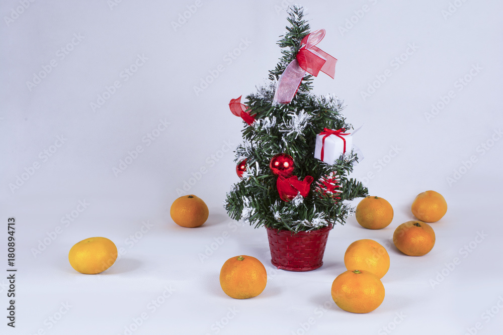 Christmas tree on a white background with tangerines