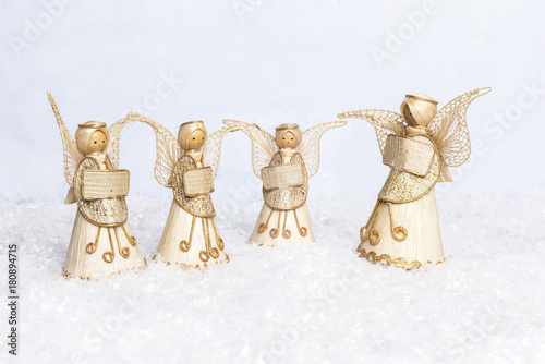 straw angels choir singing for christmas in the snow