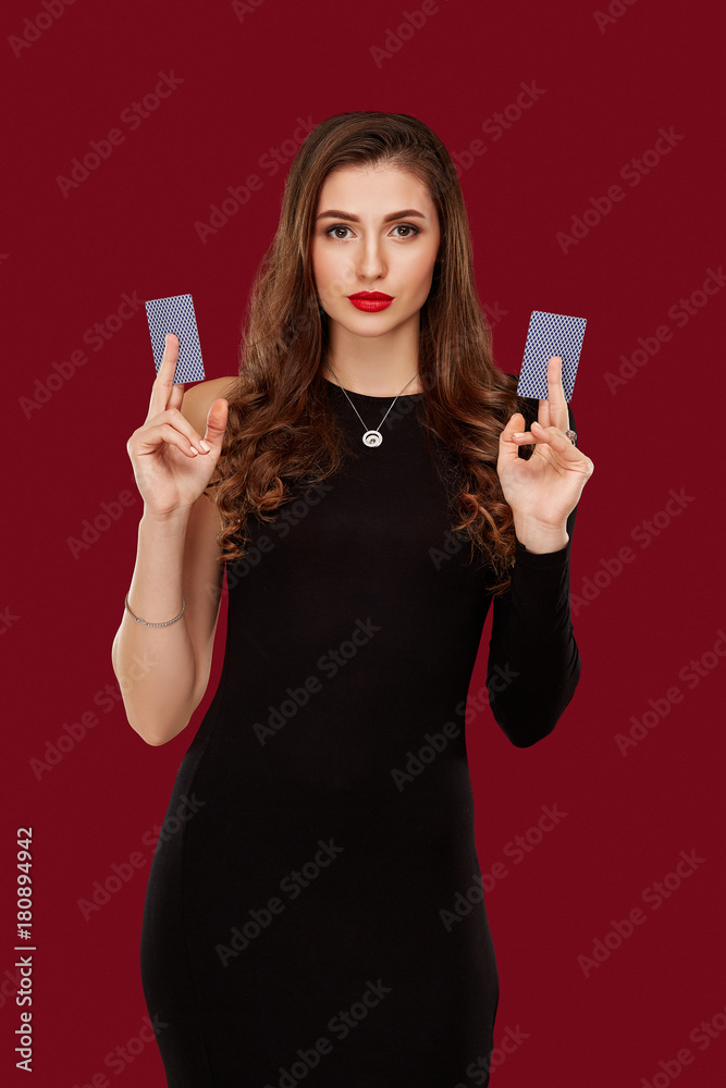 Beautiful caucasian woman in black dress with poker cards gambling in casino Beautiful caucasian woman in black dress with poker cards gambling in casino