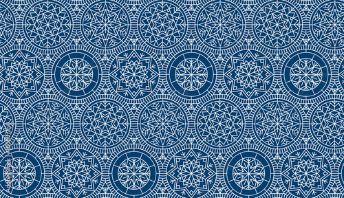 Dark blue repeatable motif for holiday wrapping paper, fabric, backdrop. Abstract winter vector background. Xmas and New Year elegant luxury style seamless pattern.