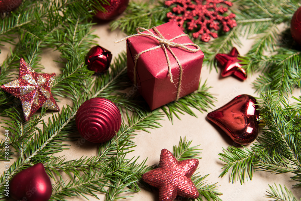 Christmas present wrapped in kraft paper with natural decoration Christmas present wrapped in kraft paper with natural decoration