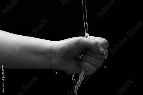 Hand holding under water