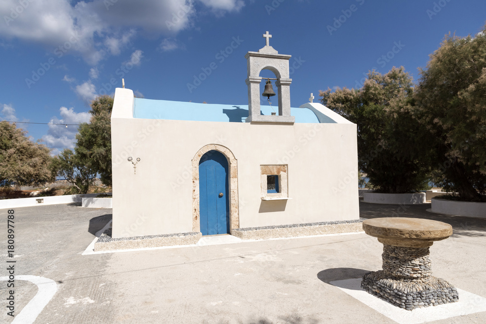 Malia Port, Lasithi, Crete, Greece, October 2017.  A small fisherman' s chapel painted blue and cream colour