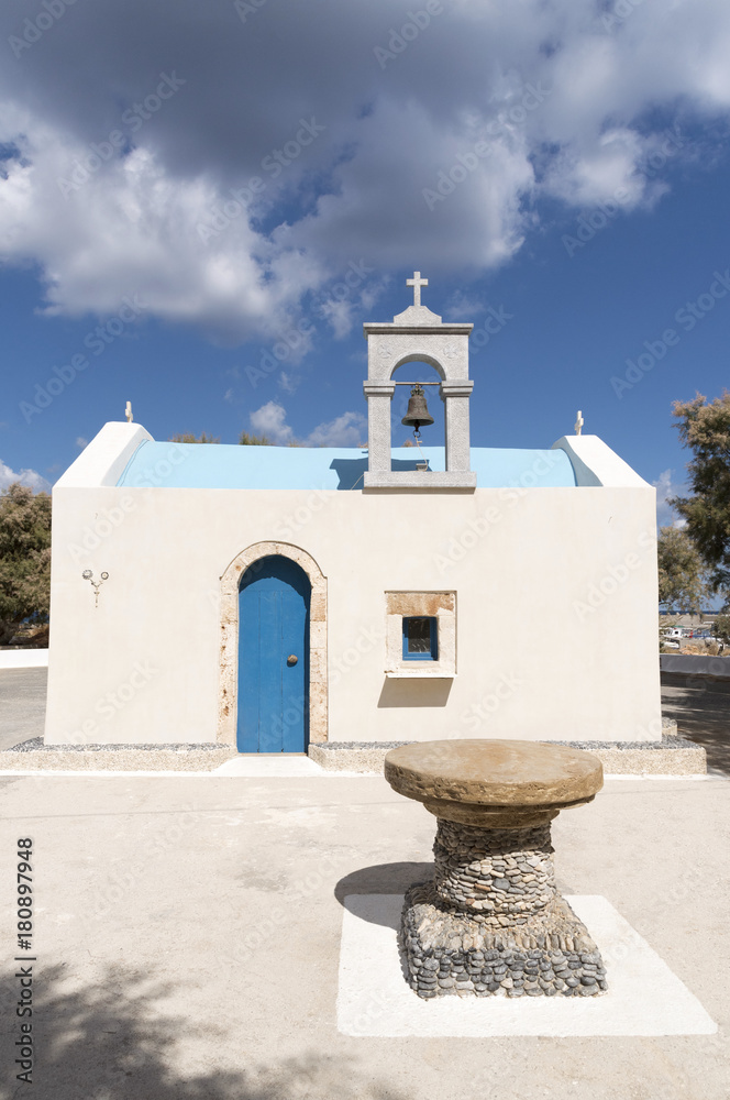 Malia Port, Lasithi, Crete, Greece, October 2017.  A small fisherman' s chapel painted blue and cream colour