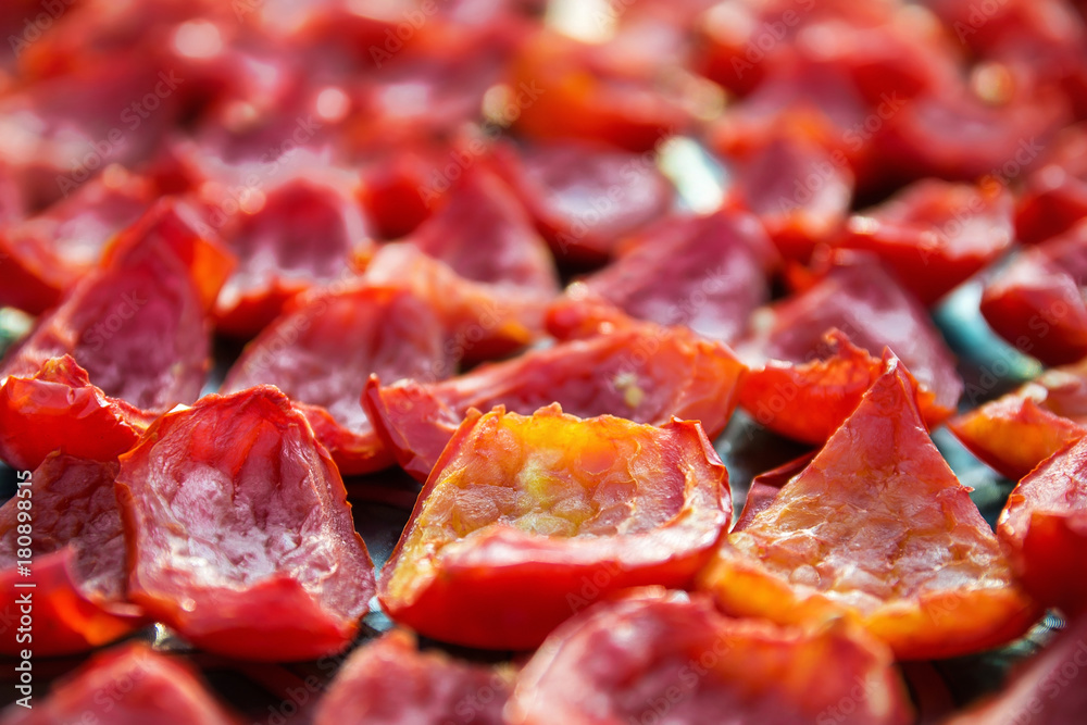 Close-up Background of Red Tomatoes Drying outdoors in the sun