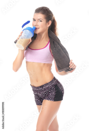 Beautiful young woman drink...