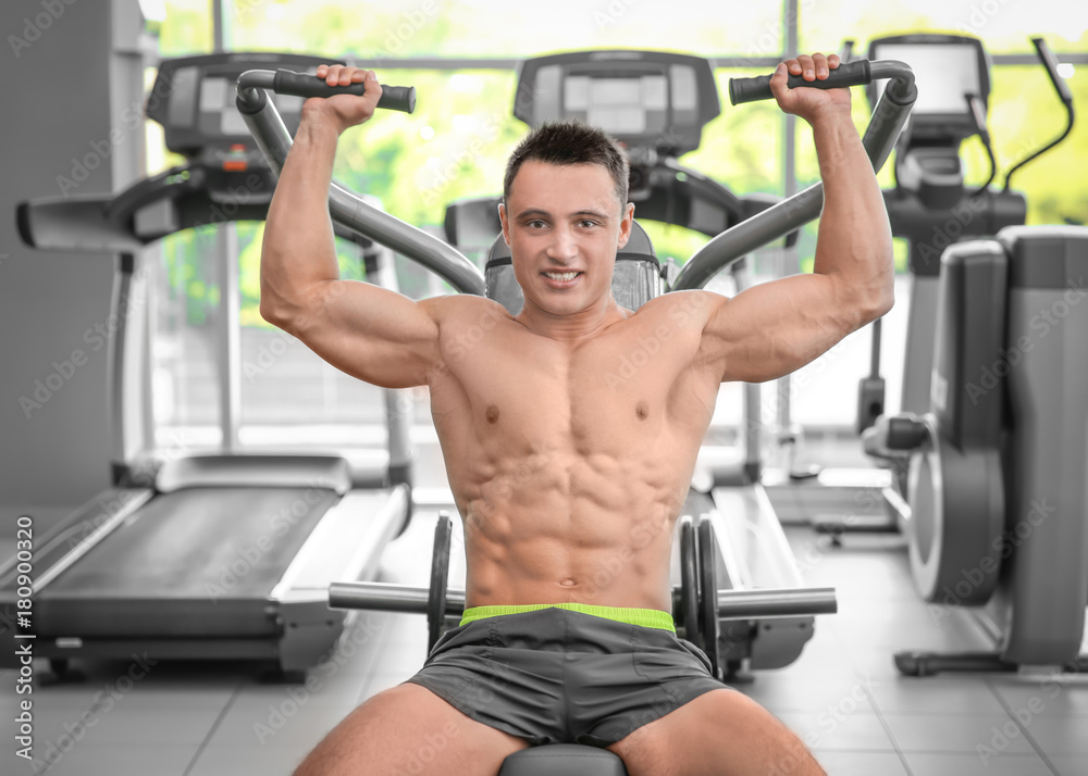 Muscular man training in gym Muscular man training in gym