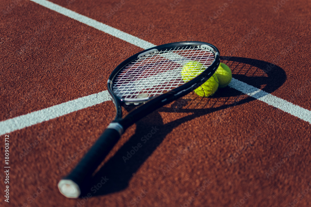 Tennis racket and balls. Tennis rackets and tennis balls lying down on tennis court
