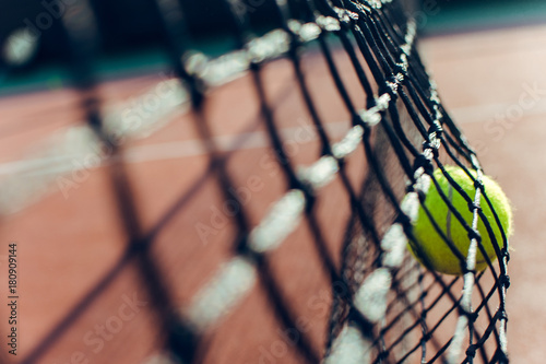 Fail shot. Tennis ball leaning to tennis net © MARIIA