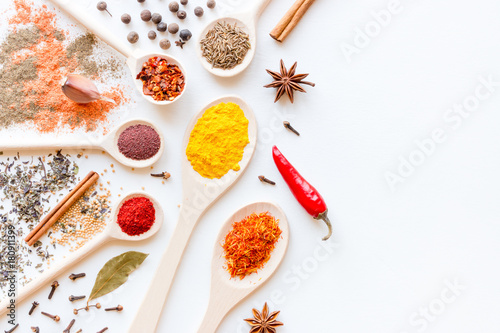 Spices and herbs on a white background with place for text