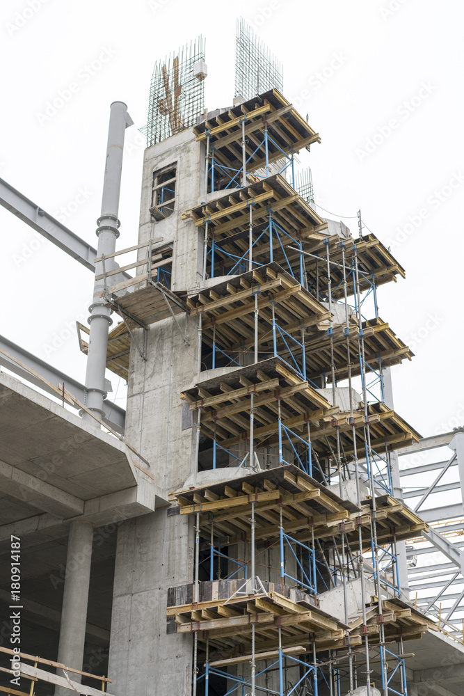 Construction of a concrete house. retaining scaffolding