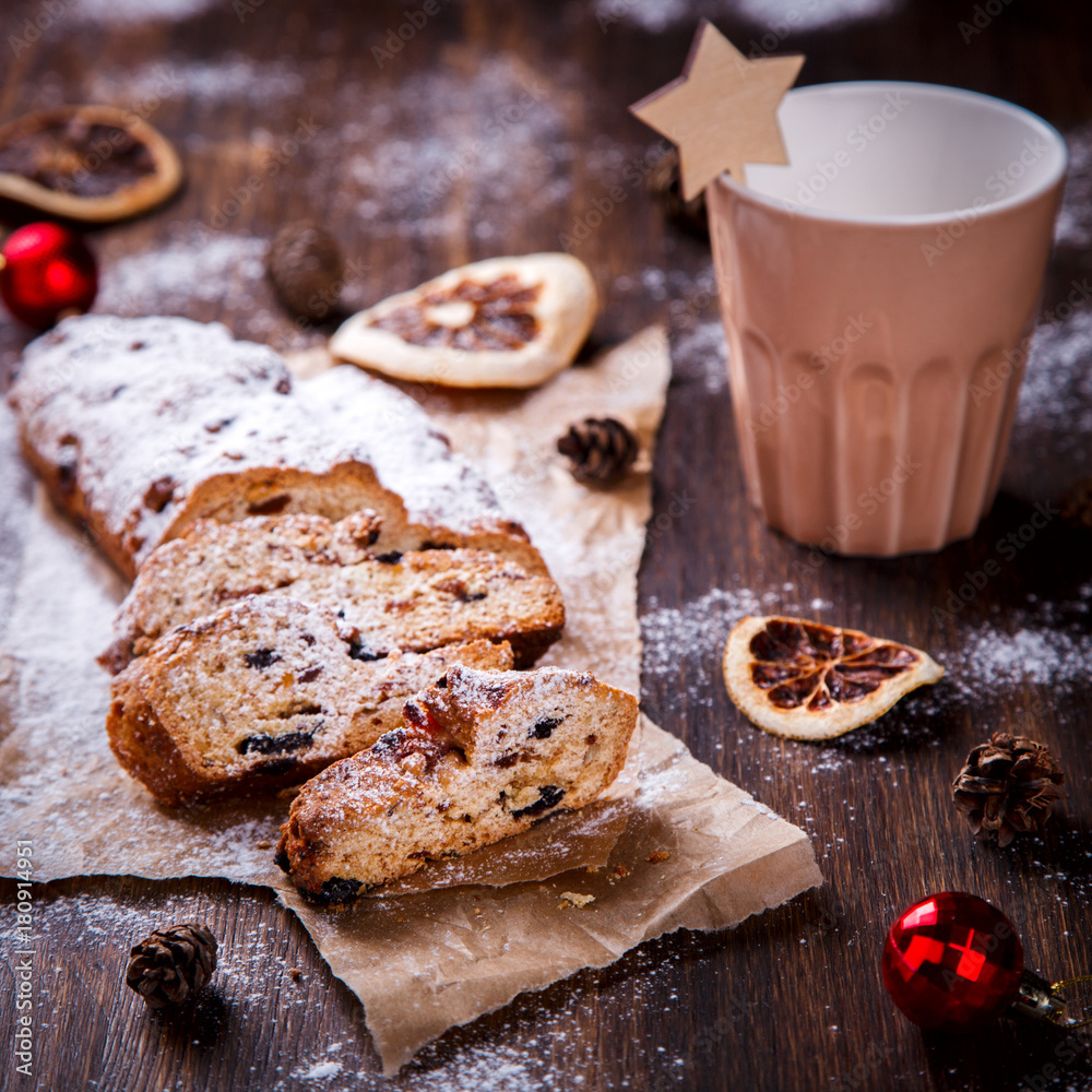 Christmas or New Year pastries Holidays Concept Dresdnen Stollen is a Traditional German Cake Gift Fruit Cake for the Holiday European festive dessert Tradition of Decoration Background