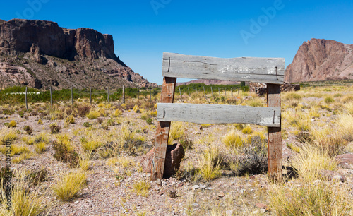 Wooden signpost  in farmland photo