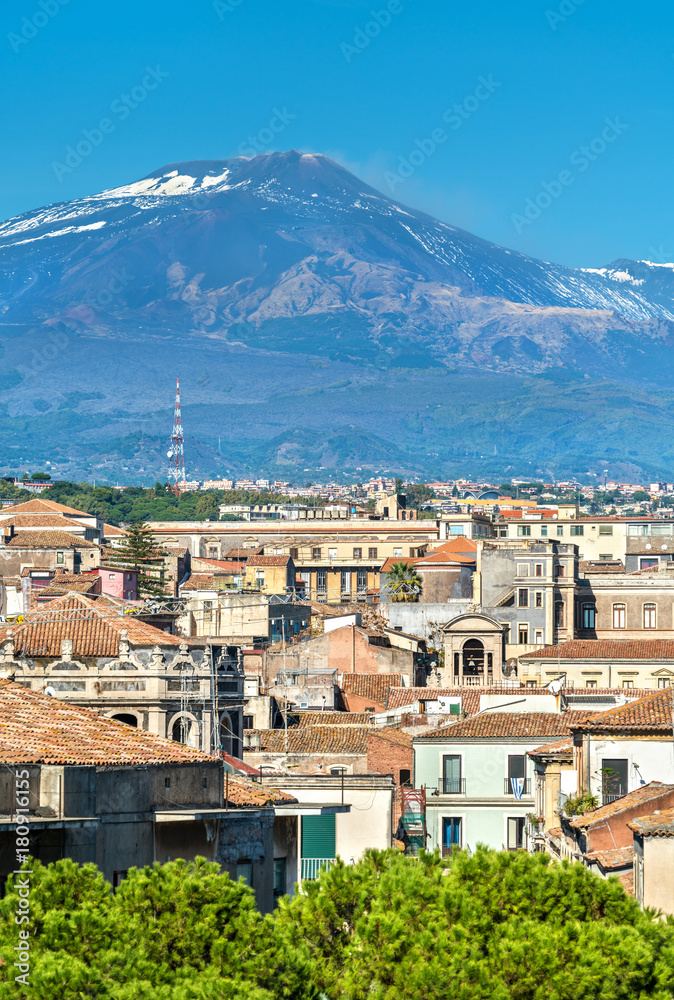 View of the historic centre of Catania with Etna Volcano in the background. Italy, Sicily