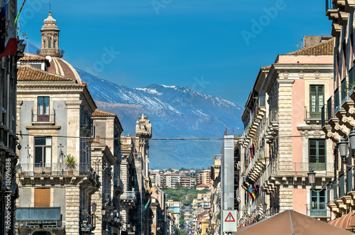View of the historic centre of Catania with Etna Volcano in the background. Italy, Sicily