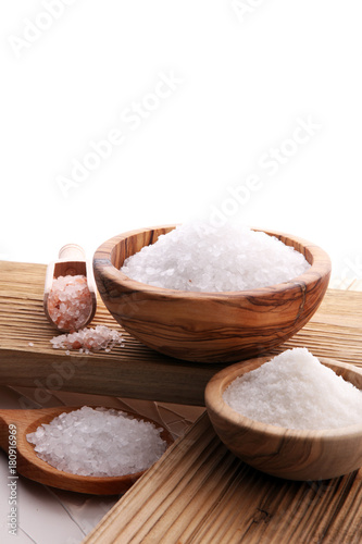 differnt kind of salt in wooden bowl and spoon.