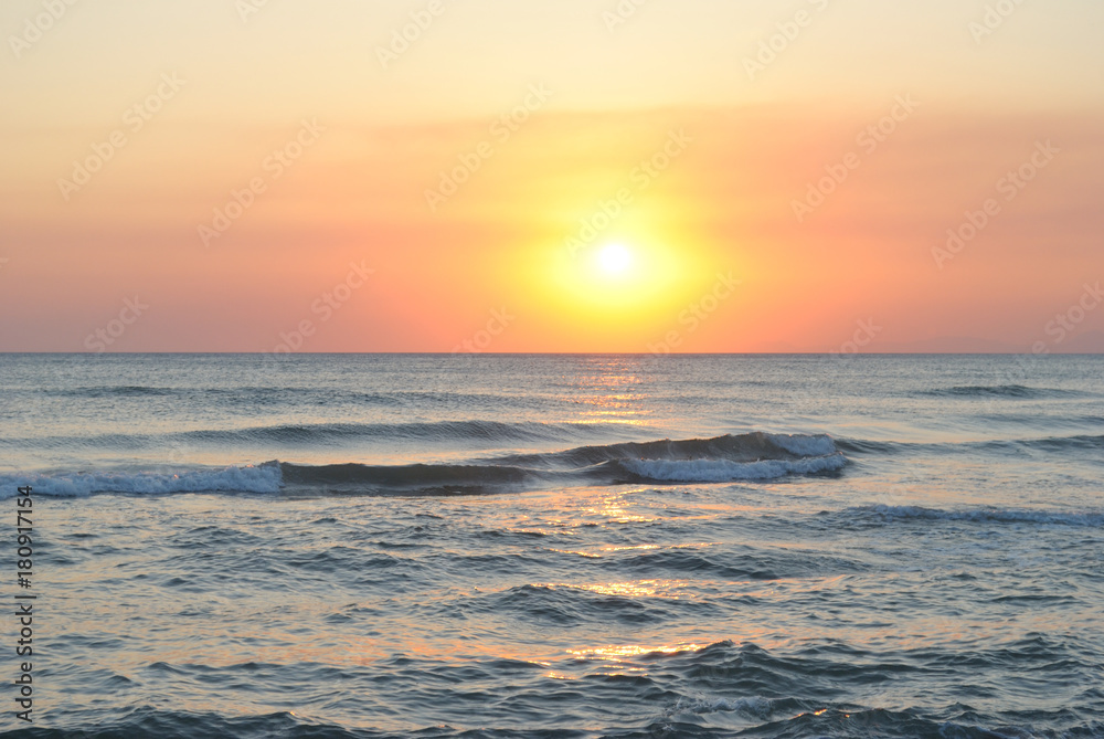 orange sunset on the sea waves