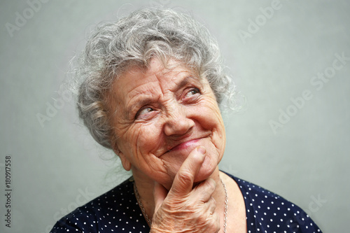 Smile and thinking grandmother face
