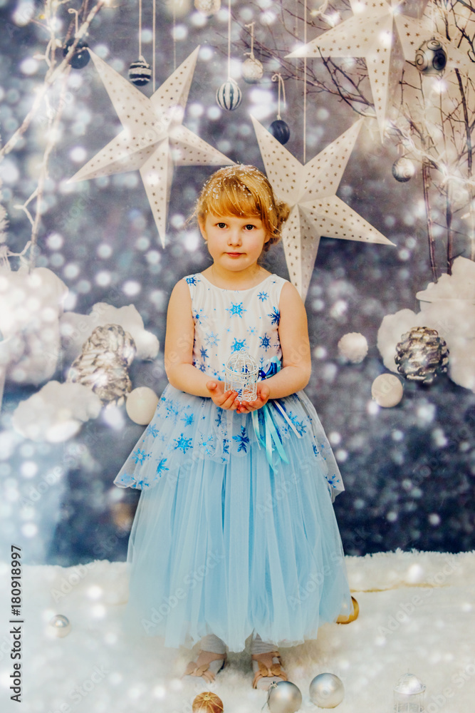 Two little girls sitting near the Christmas tree and wait for the New year
Two little girls sitting near the Christmas tree and wait for the New year