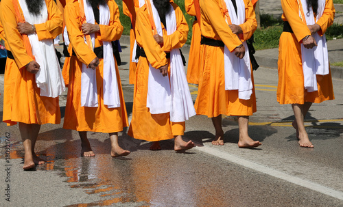 people with orange dresses during the religious Sikh event on th