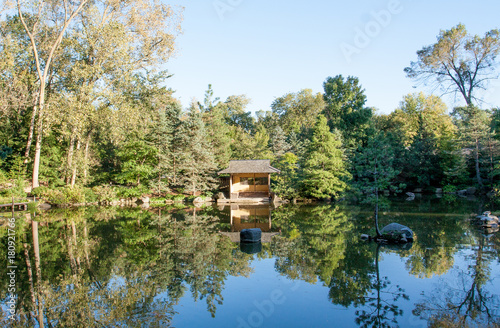 A calm zen pond, reflecting the surrounding wood. - Zen garden, Rockford, IL USA
