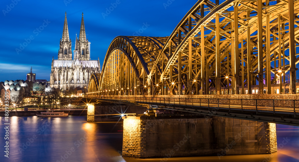 Cologne Cathedral Illuminated With Hohenzollern Bridge